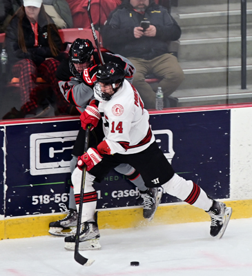 hard into the boards