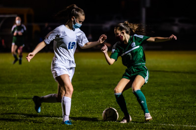 Chazy's Ava McAuliffe looks to dribble the ball past Seton defender Elizabeth Manion