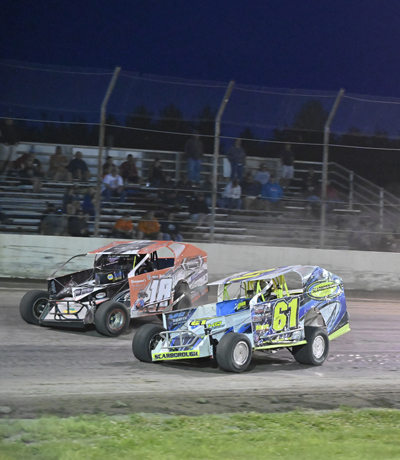 Chris Cayea(18) battles John Scarborough(61) in J&S Steel Sportsman Modifieds A Main Chris Cayea(18) battles John Scarborough(61) in J&S Steel Sportsman Modifieds A Main