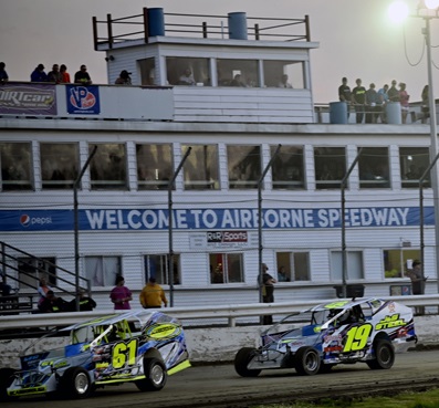 John Scarborough (61) wins over Jamy Begor (19) in the J&S Steel Sportsman Modifieds A Main