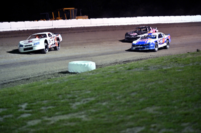 Kevin Featherly(57K) leads Justin White(1) & Tyler Bushey (#15) in the Pro Stock A Main
