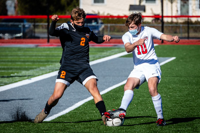 Plattsburgh's Jack Ferris (2) and Beekmantown's Collin Hemingway (10) get to the ball simultaneously